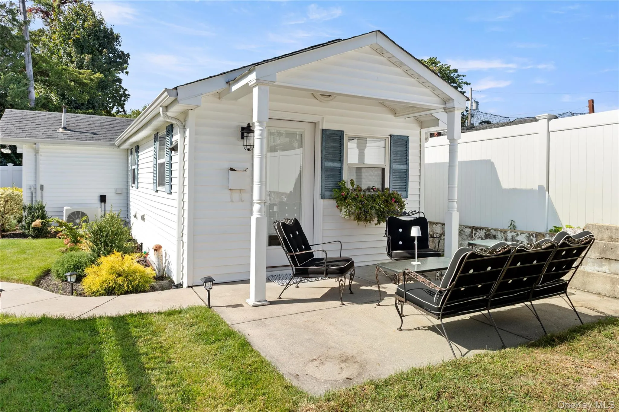 Back of house with a patio Back of house with a patio
