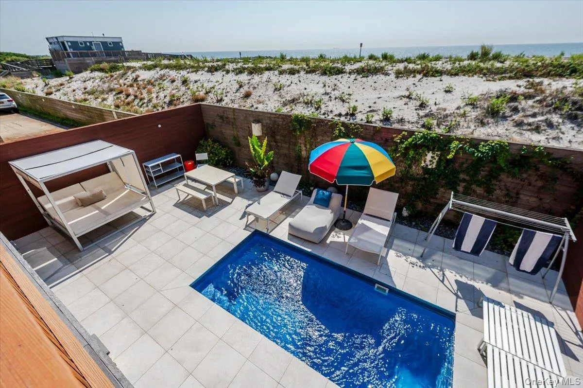 View of pool featuring a patio area and area for grilling View of pool featuring a patio area and area for grilling