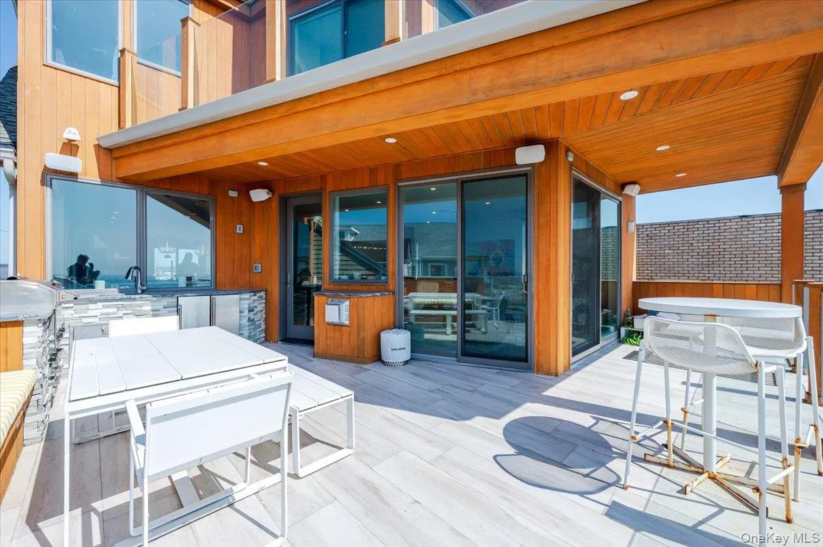 View of patio featuring outdoor dining area View of patio featuring outdoor dining area