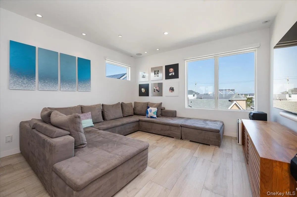 Living room featuring recessed lighting and light wood-style floors Living room featuring recessed lighting and light wood-style floors