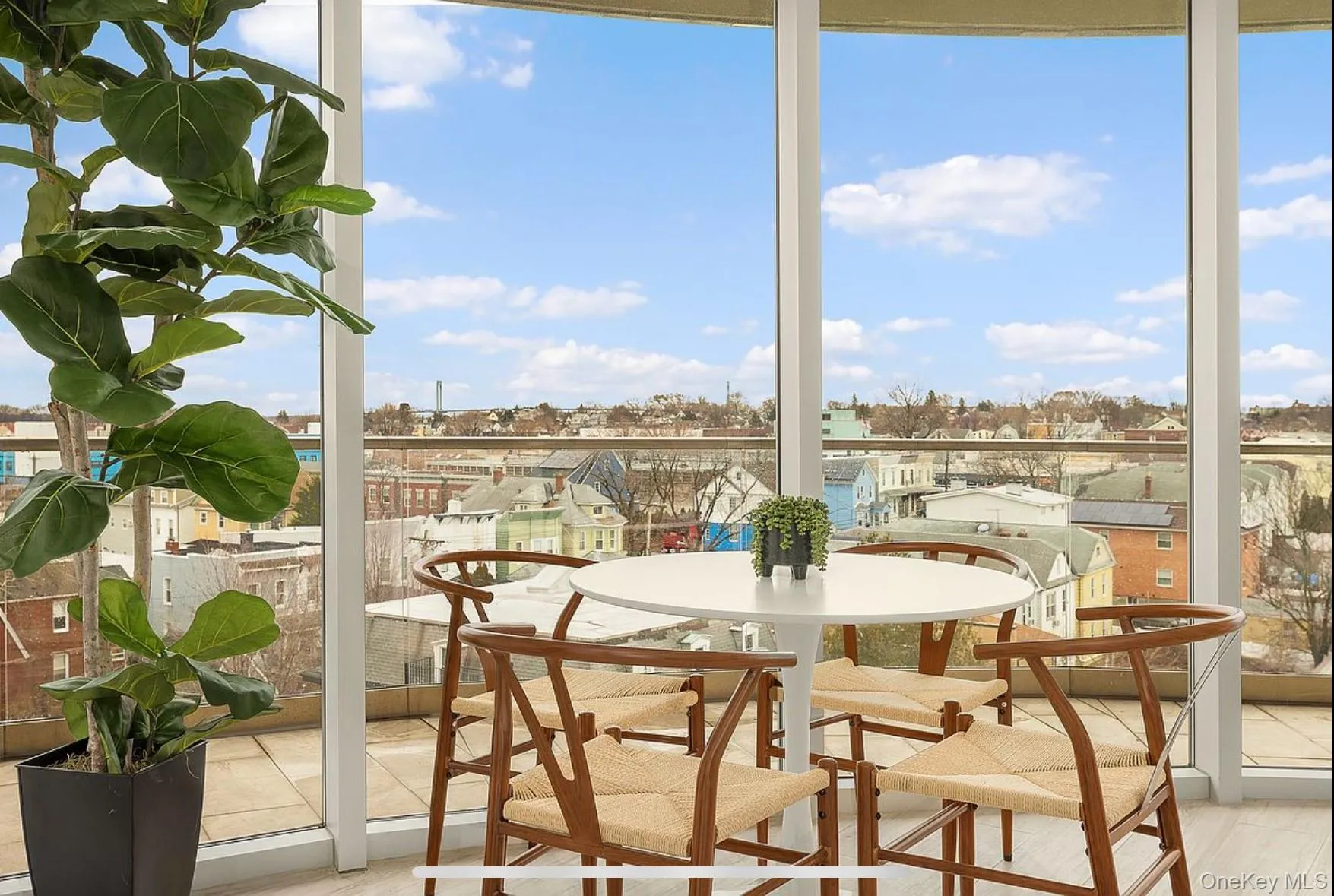 Sunroom with plenty of natural light and a water view Sunroom with plenty of natural light and a water view