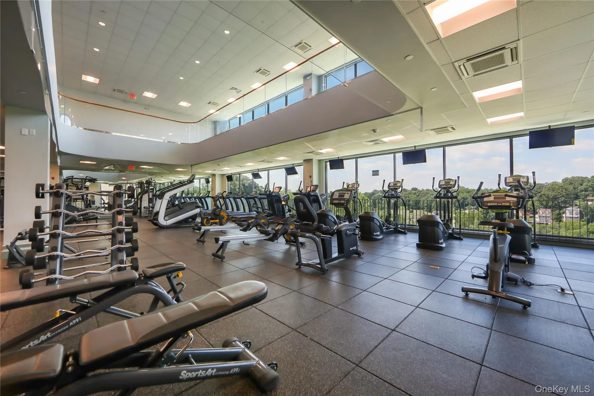 Exercise room featuring a wall of windows Exercise room featuring a wall of windows