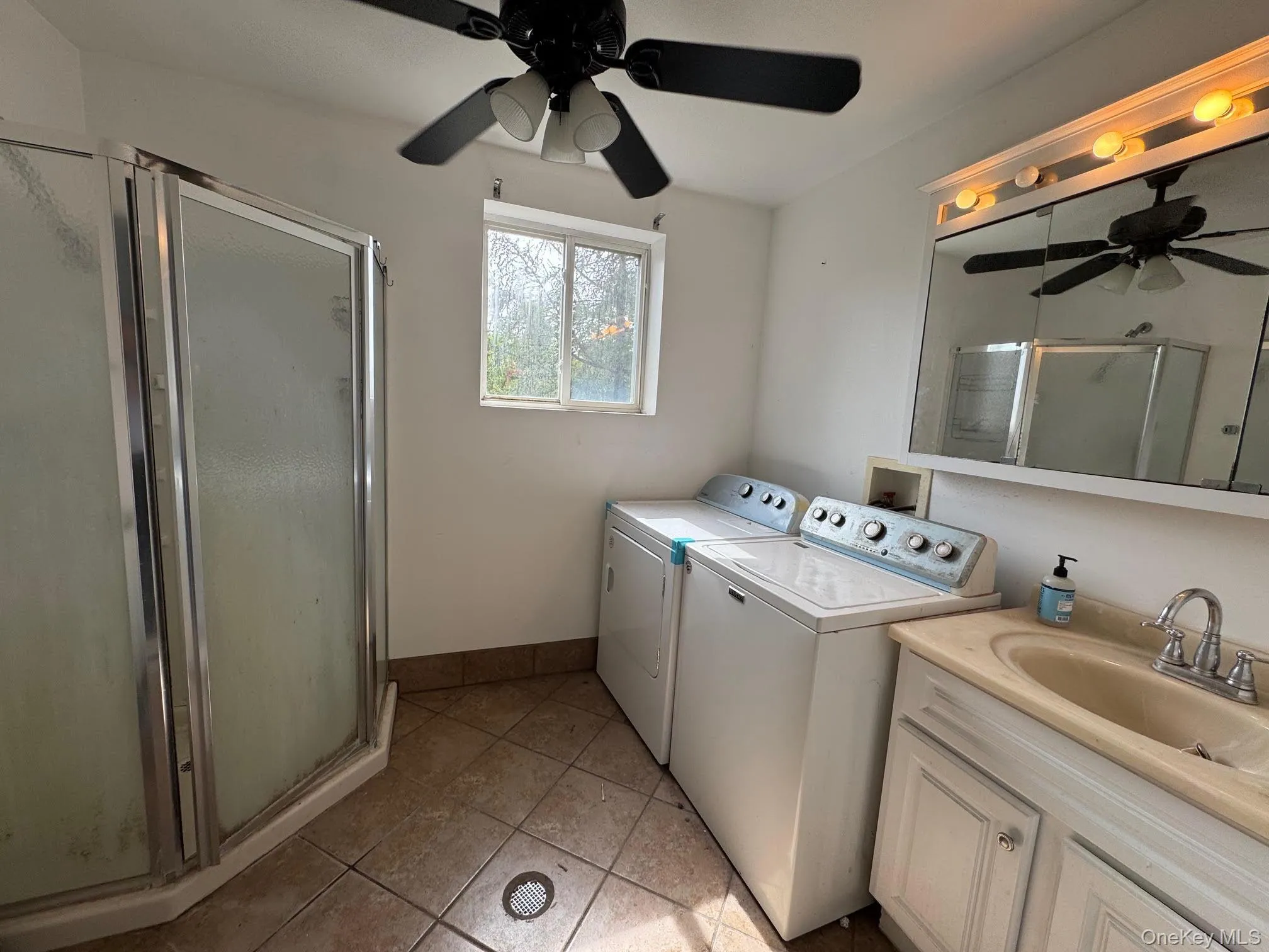 Second floor full bathroom with window and combination bathroom & laundry room with window. Second floor full bathroom with window and combination bathroom & laundry room with window.