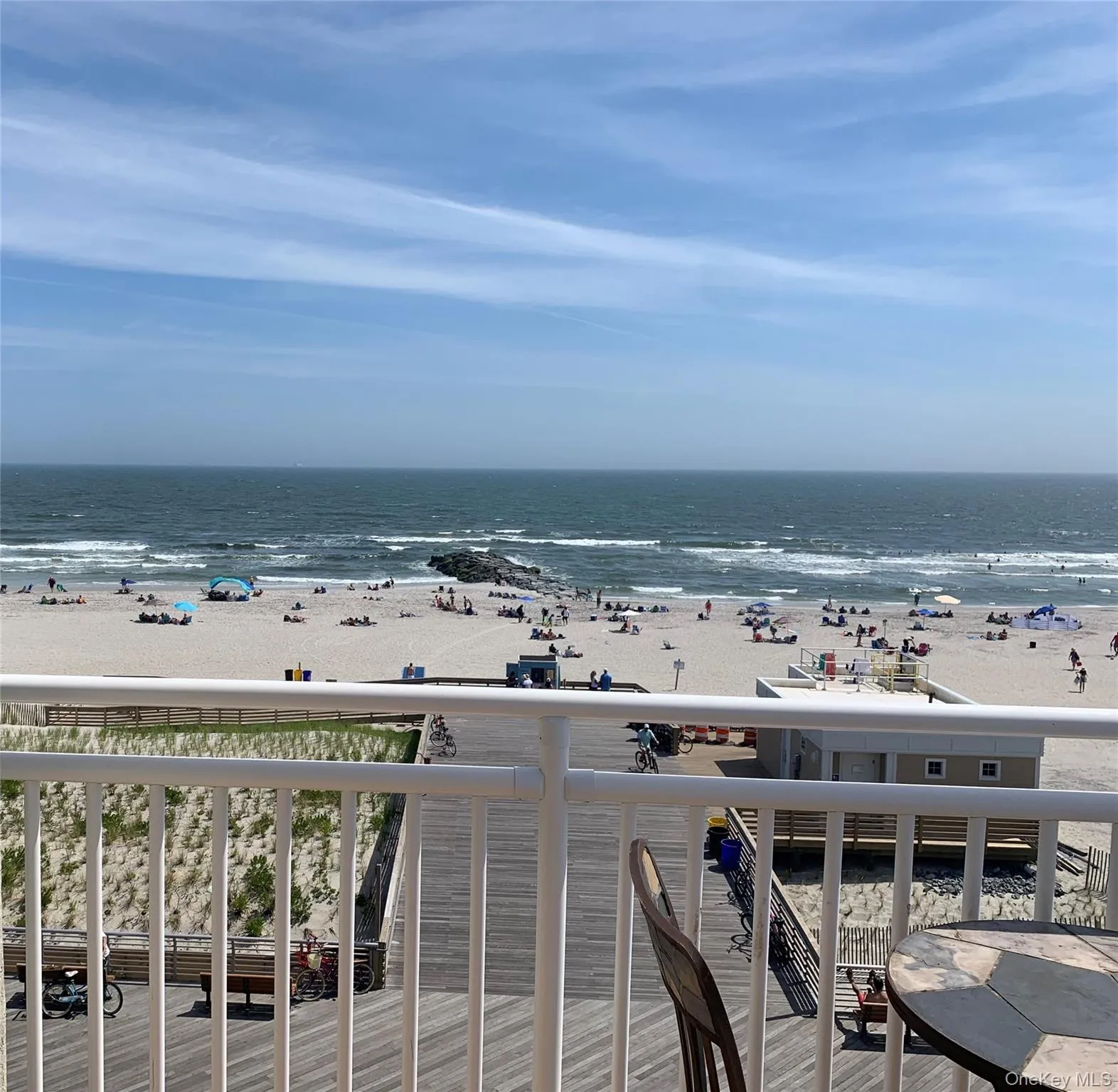 Balcony with view of water and beach Balcony with view of water and beach