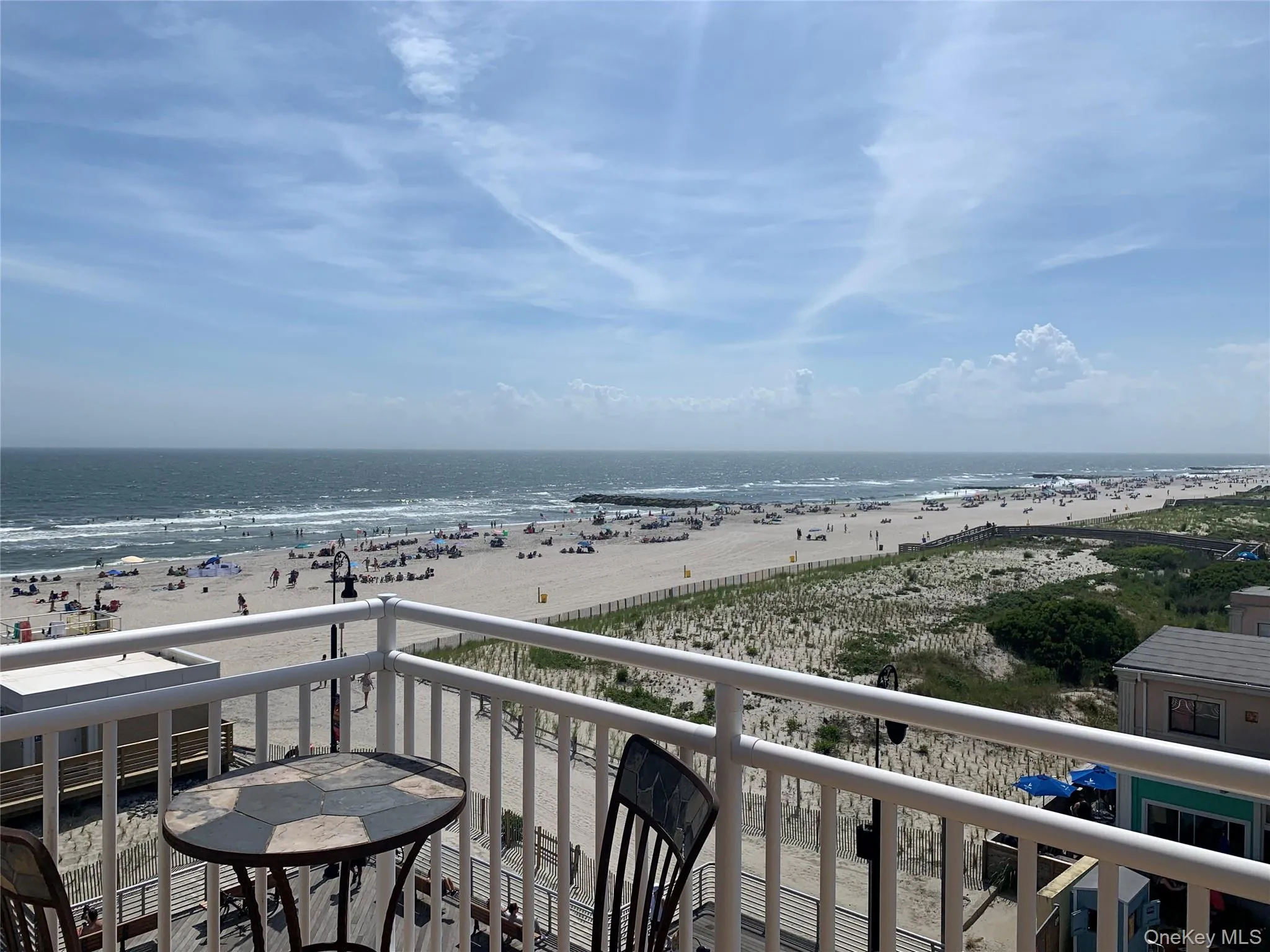 Balcony featuring view of water and beach Balcony featuring view of water and beach