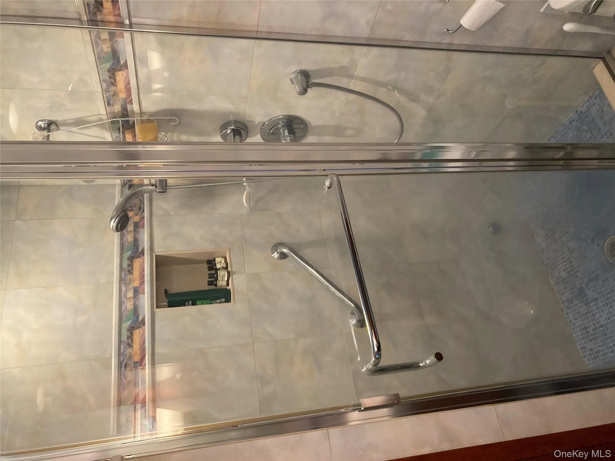 Full bathroom with a shower stall Full bathroom with a shower stall