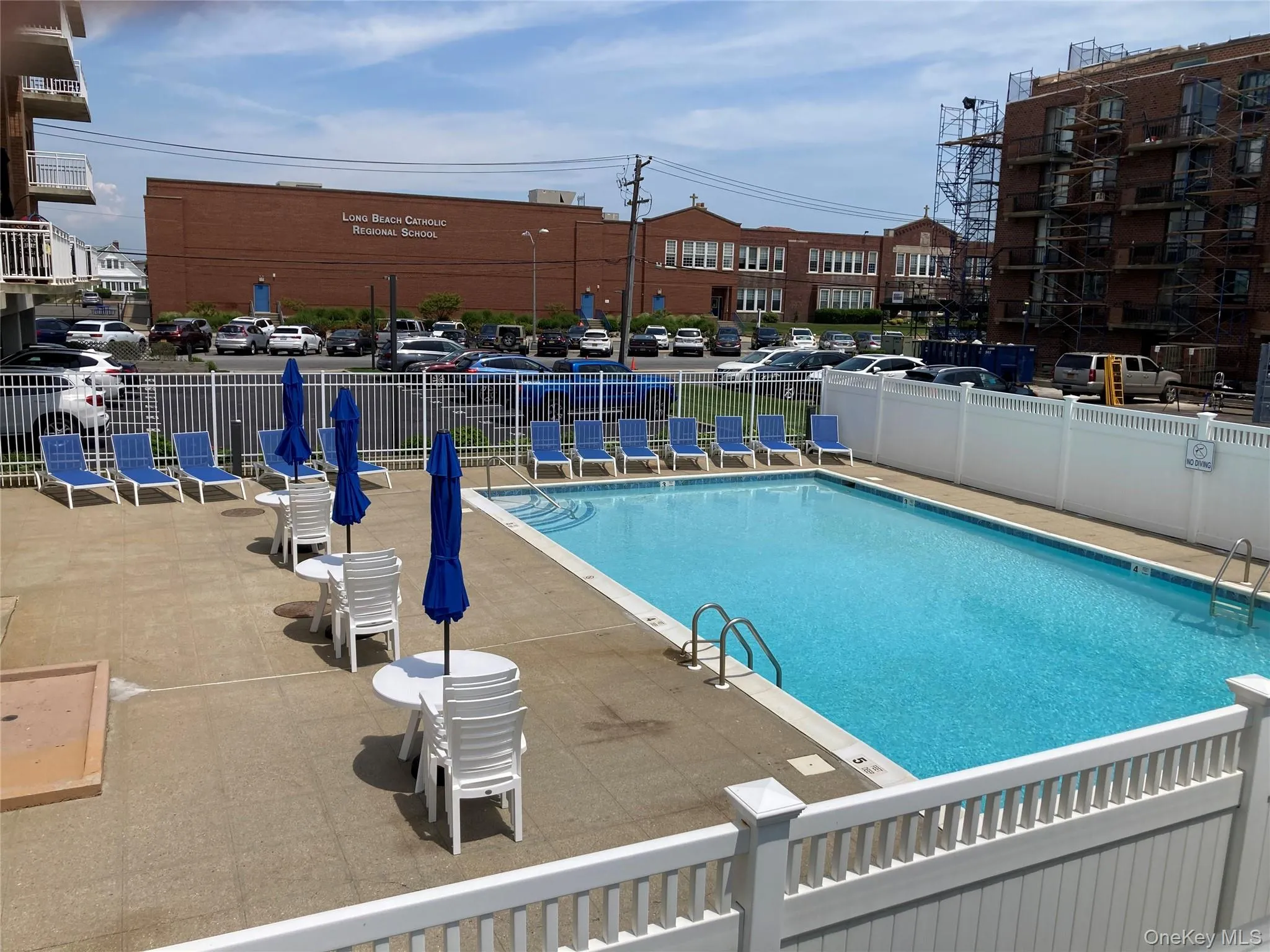 Community pool with a patio Community pool with a patio