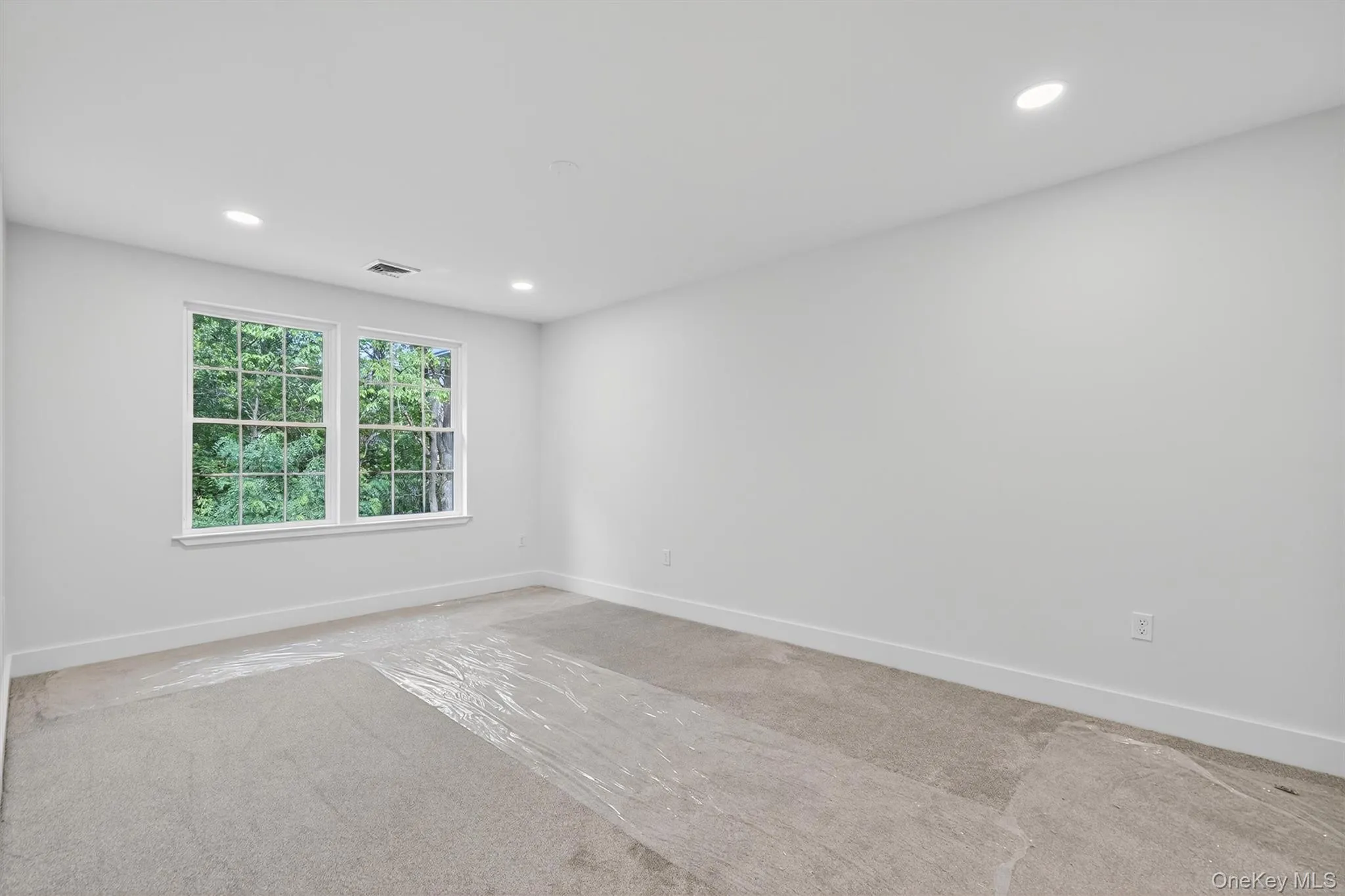 Spare room with recessed lighting and carpet floors Spare room with recessed lighting and carpet floors