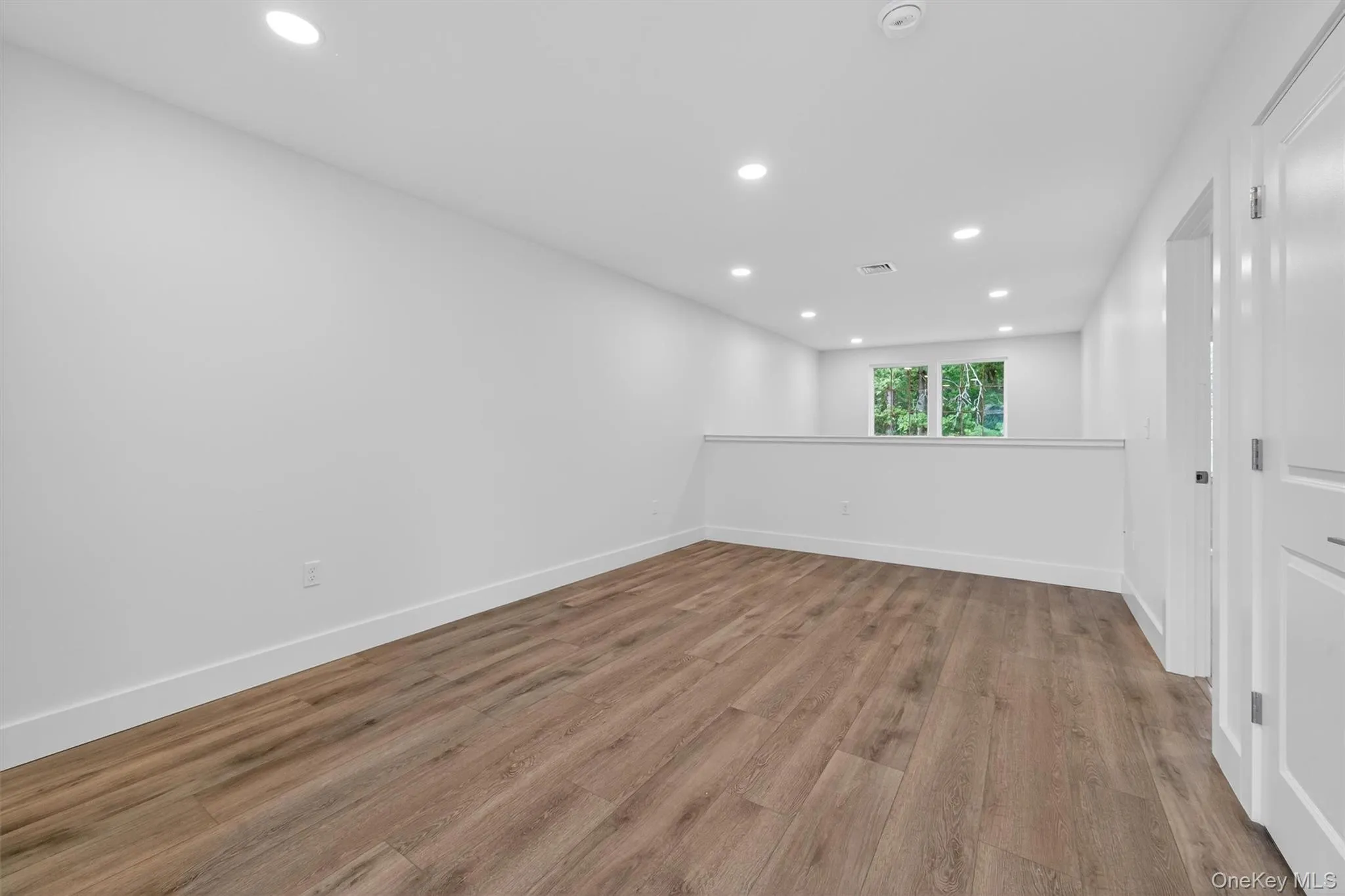 Spare room with recessed lighting and light wood-type flooring Spare room with recessed lighting and light wood-type flooring