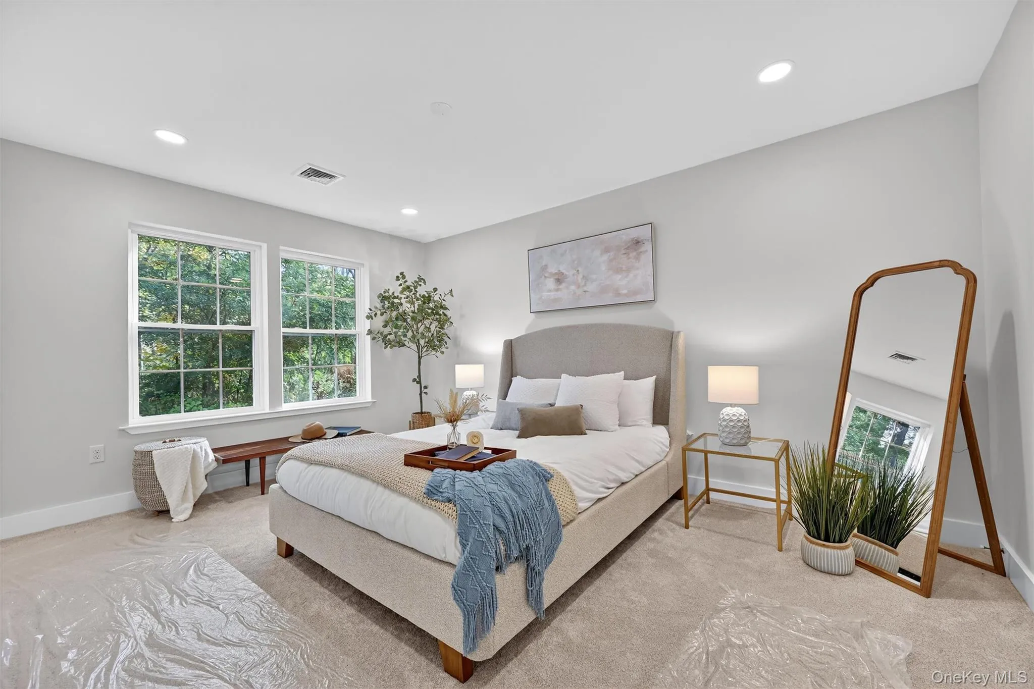 Bedroom with multiple windows, carpet floors, and recessed lighting Bedroom with multiple windows, carpet floors, and recessed lighting