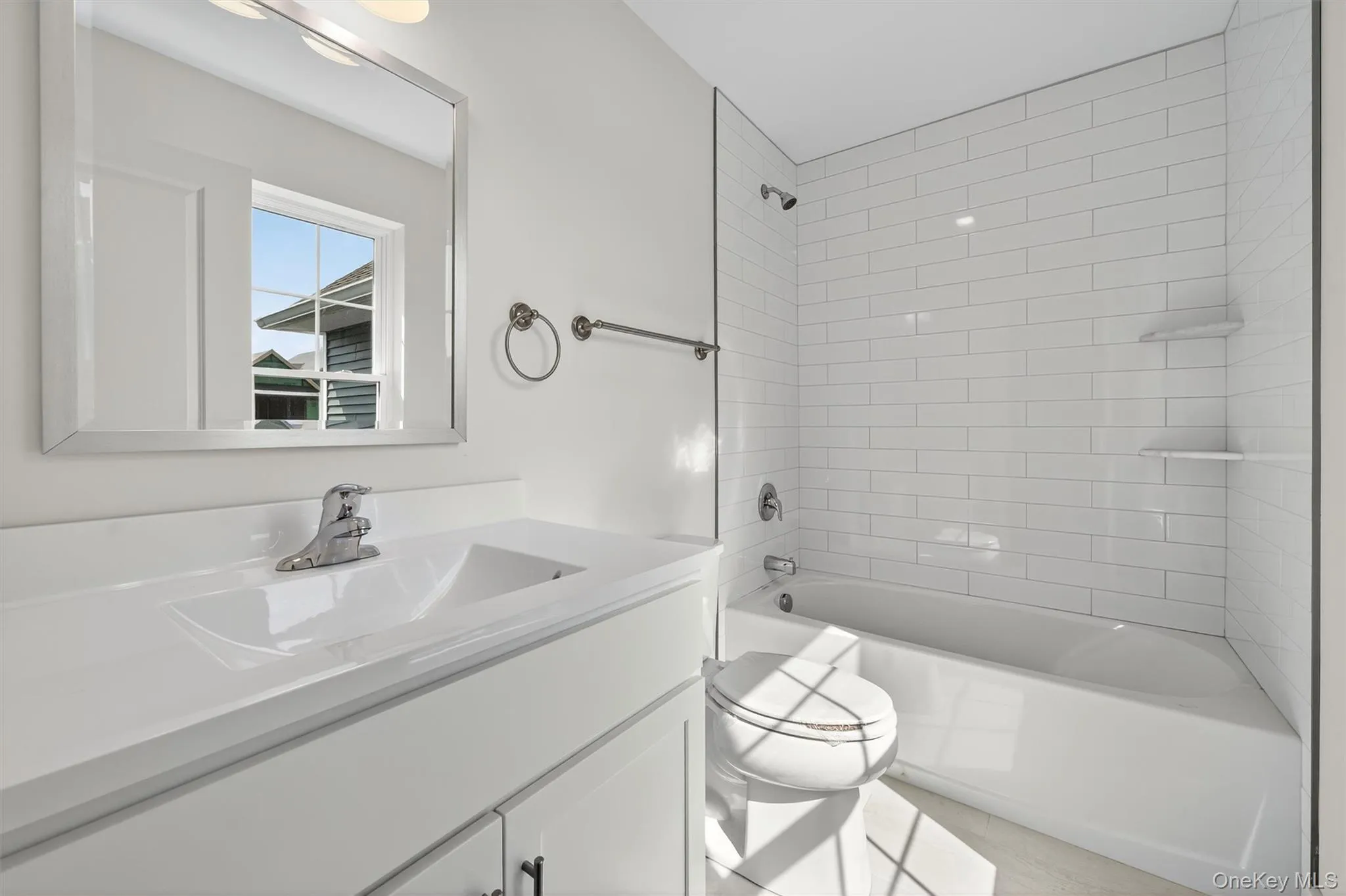 Full bathroom featuring shower / bath combination and vanity Full bathroom featuring shower / bath combination and vanity