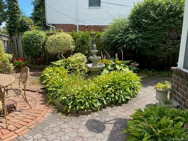 View of yard with a patio area View of yard with a patio area