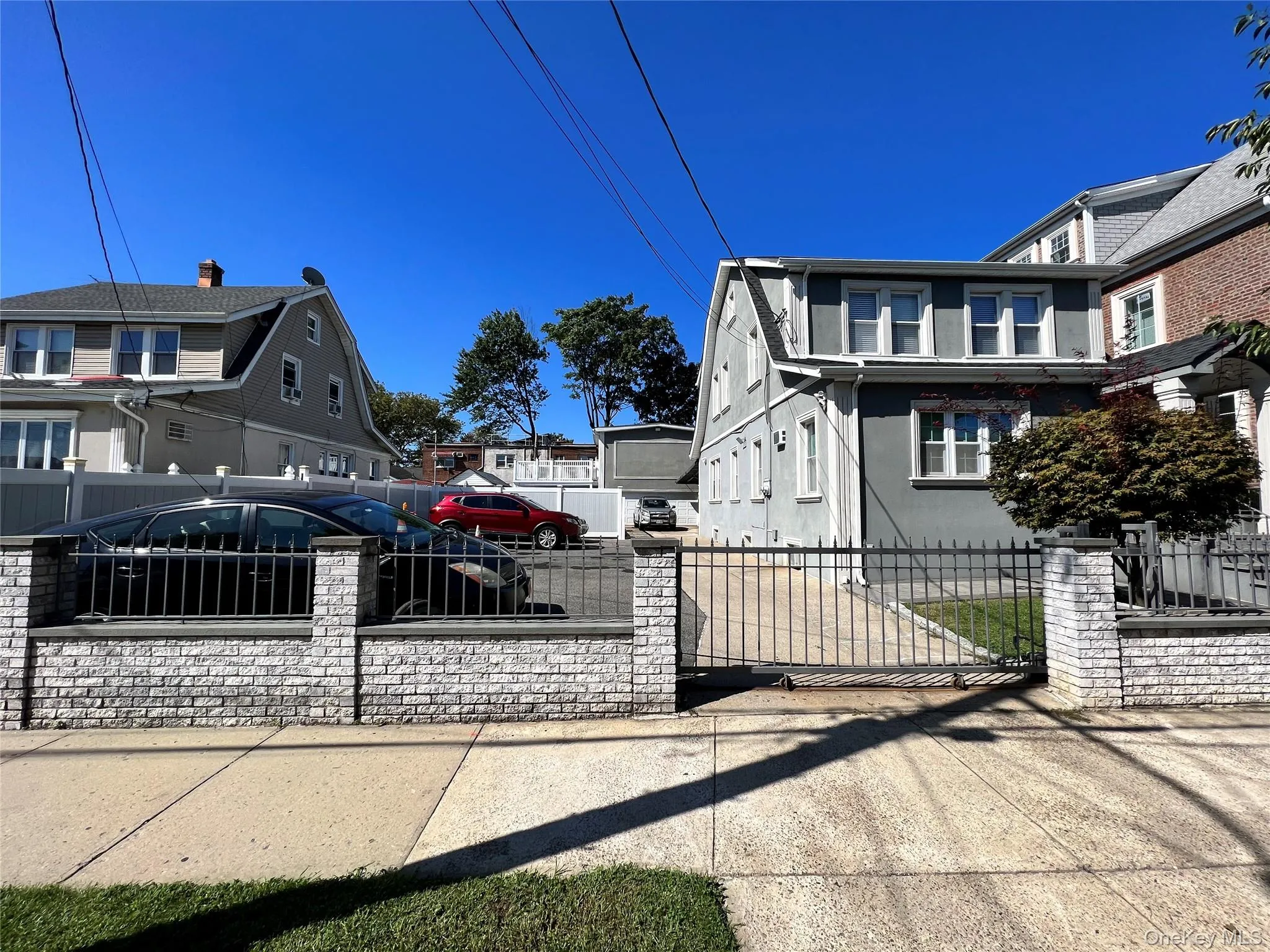 View of home's exterior with a fenced front yard, a gate, and stucco siding View of home's exterior with a fenced front yard, a gate, and stucco siding