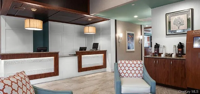 Welcome area with recessed lighting and a decorative wall Welcome area with recessed lighting and a decorative wall