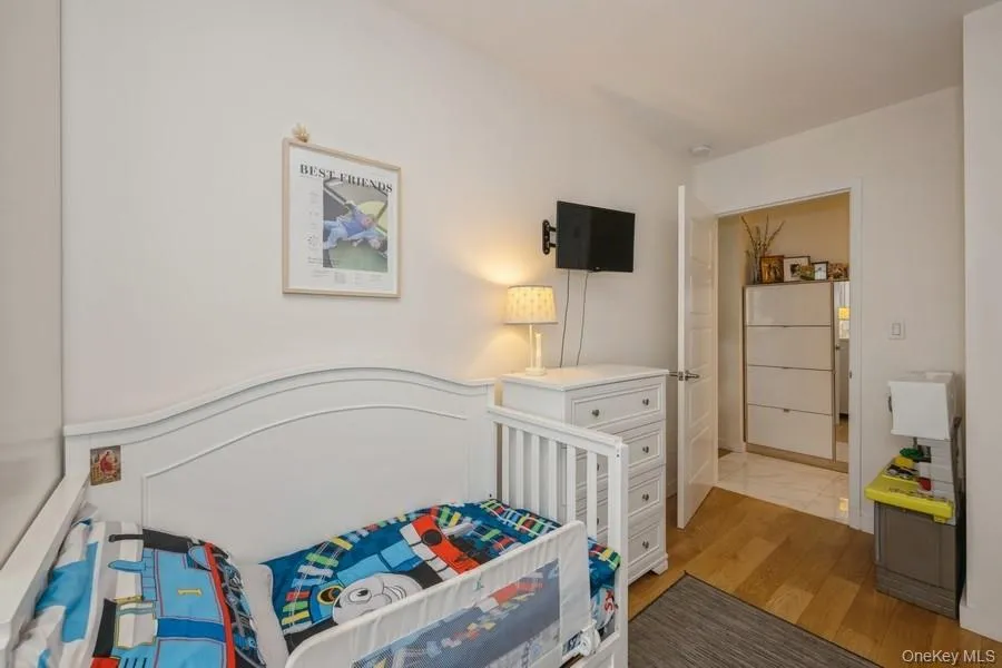 Bedroom featuring light wood-style floors Bedroom featuring light wood-style floors