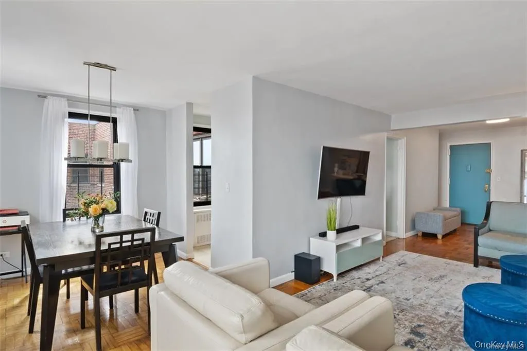 Living room featuring a chandelier and radiator Living room featuring a chandelier and radiator