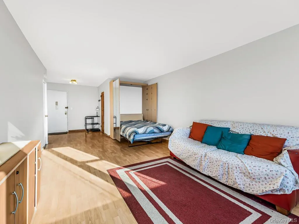 Bedroom with light wood-style flooring Bedroom with light wood-style flooring