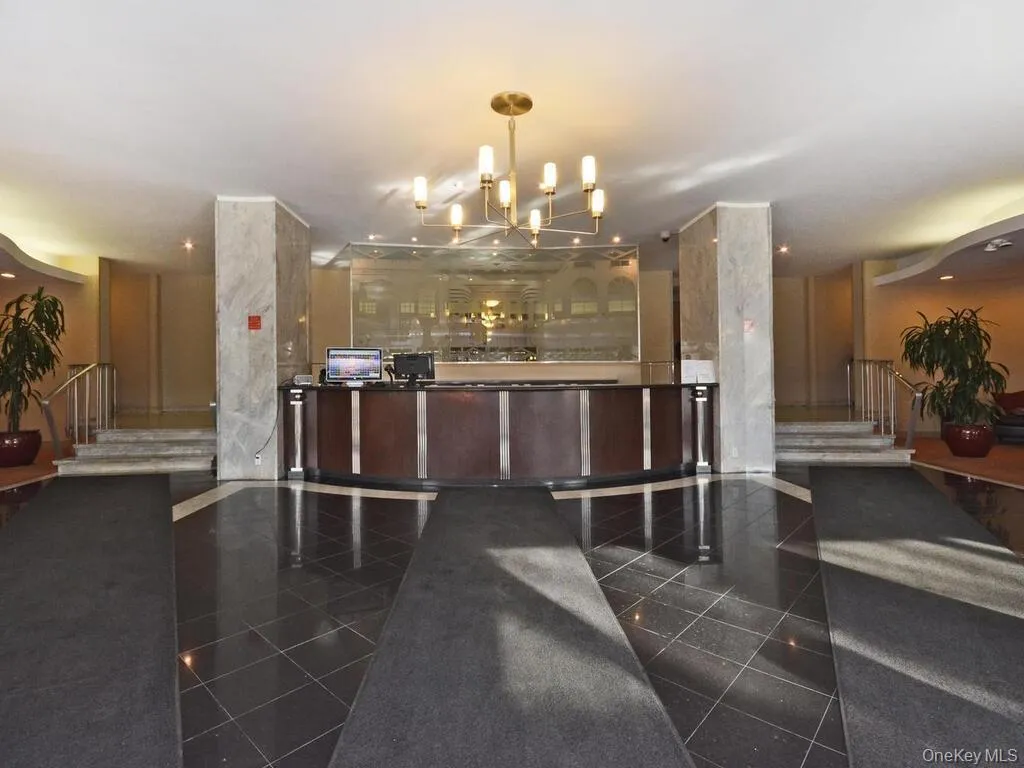 Reception with stairway and a chandelier Reception with stairway and a chandelier