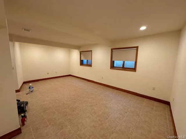 Empty room featuring baseboards and recessed lighting Empty room featuring baseboards and recessed lighting