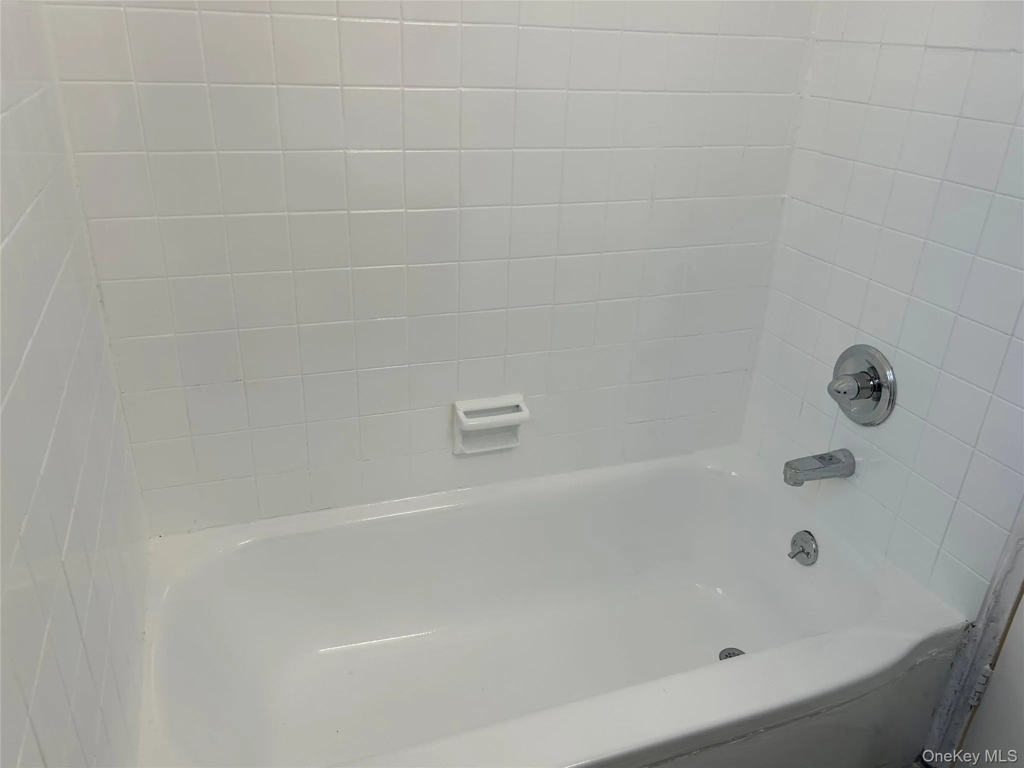 Bathroom featuring shower / bathtub combination Bathroom featuring shower / bathtub combination