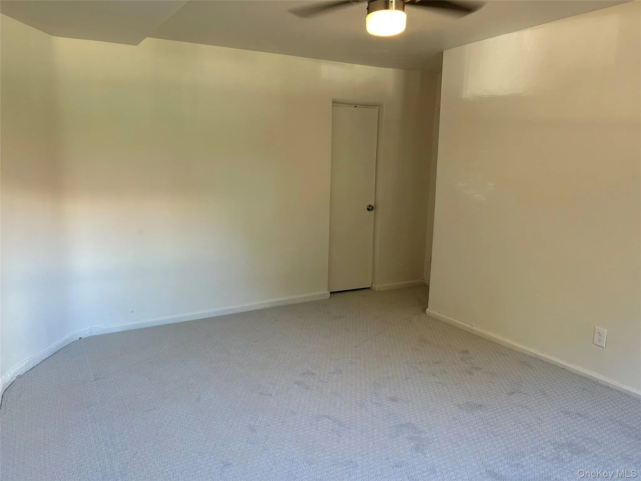 Carpeted bedroom featuring baseboards and ceiling fan Carpeted bedroom featuring baseboards and ceiling fan