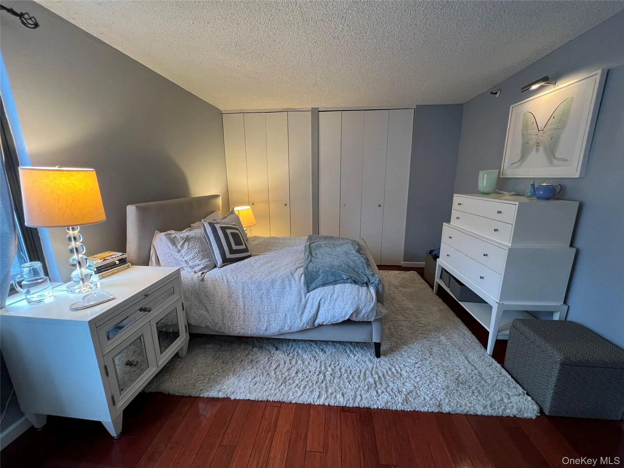 Bedroom with wood finished floors Bedroom with wood finished floors