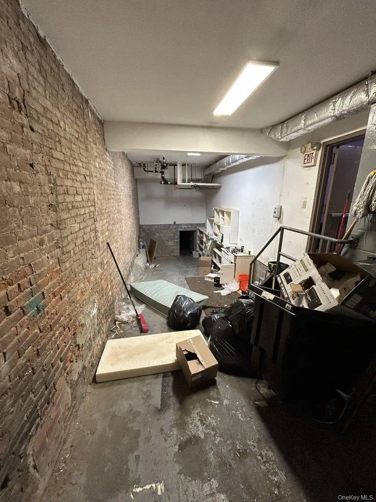 Unfinished basement with brick wall Unfinished basement with brick wall