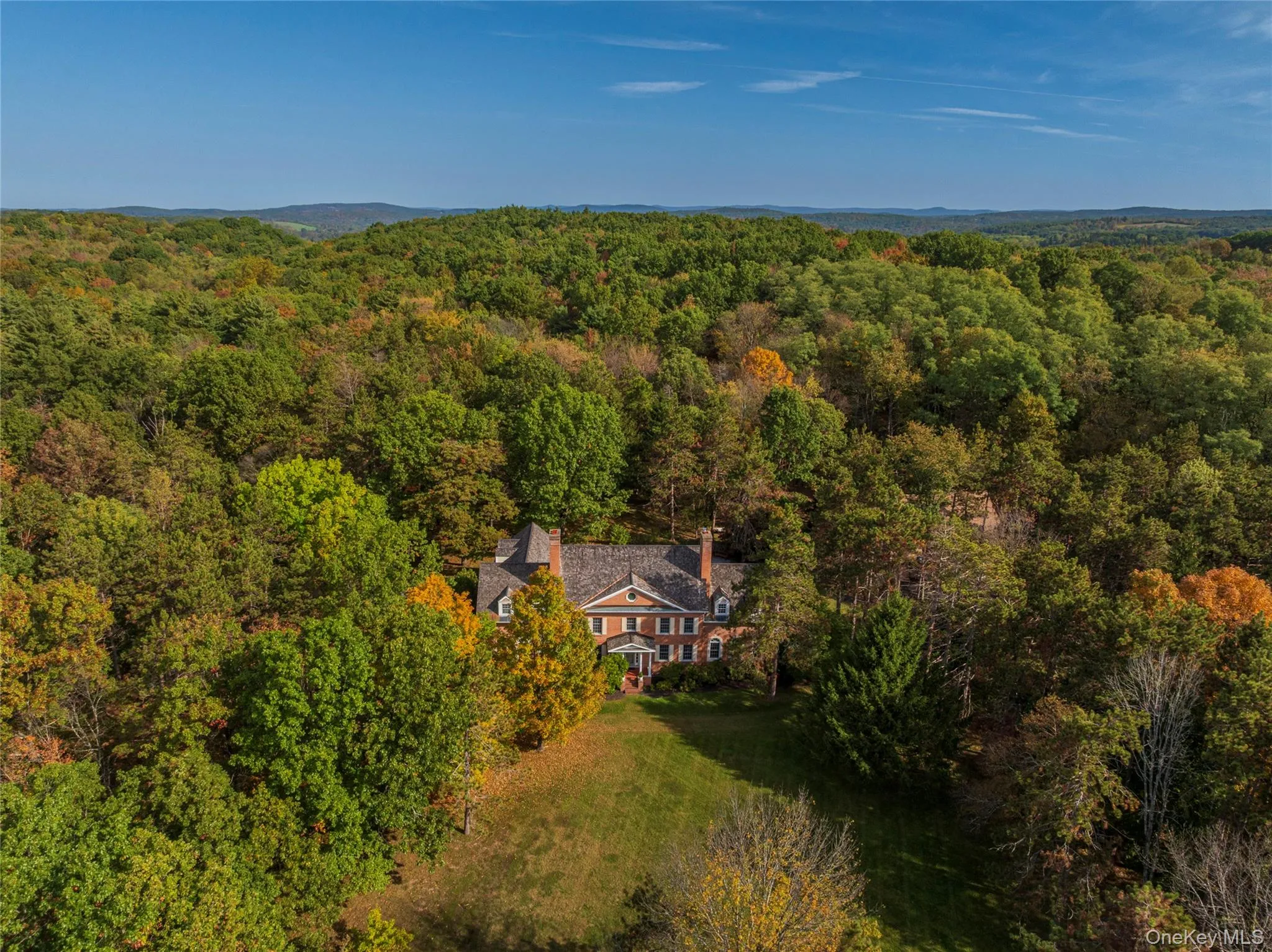 Aerial view of property and surrounding area featuring a forest Aerial view of property and surrounding area featuring a forest