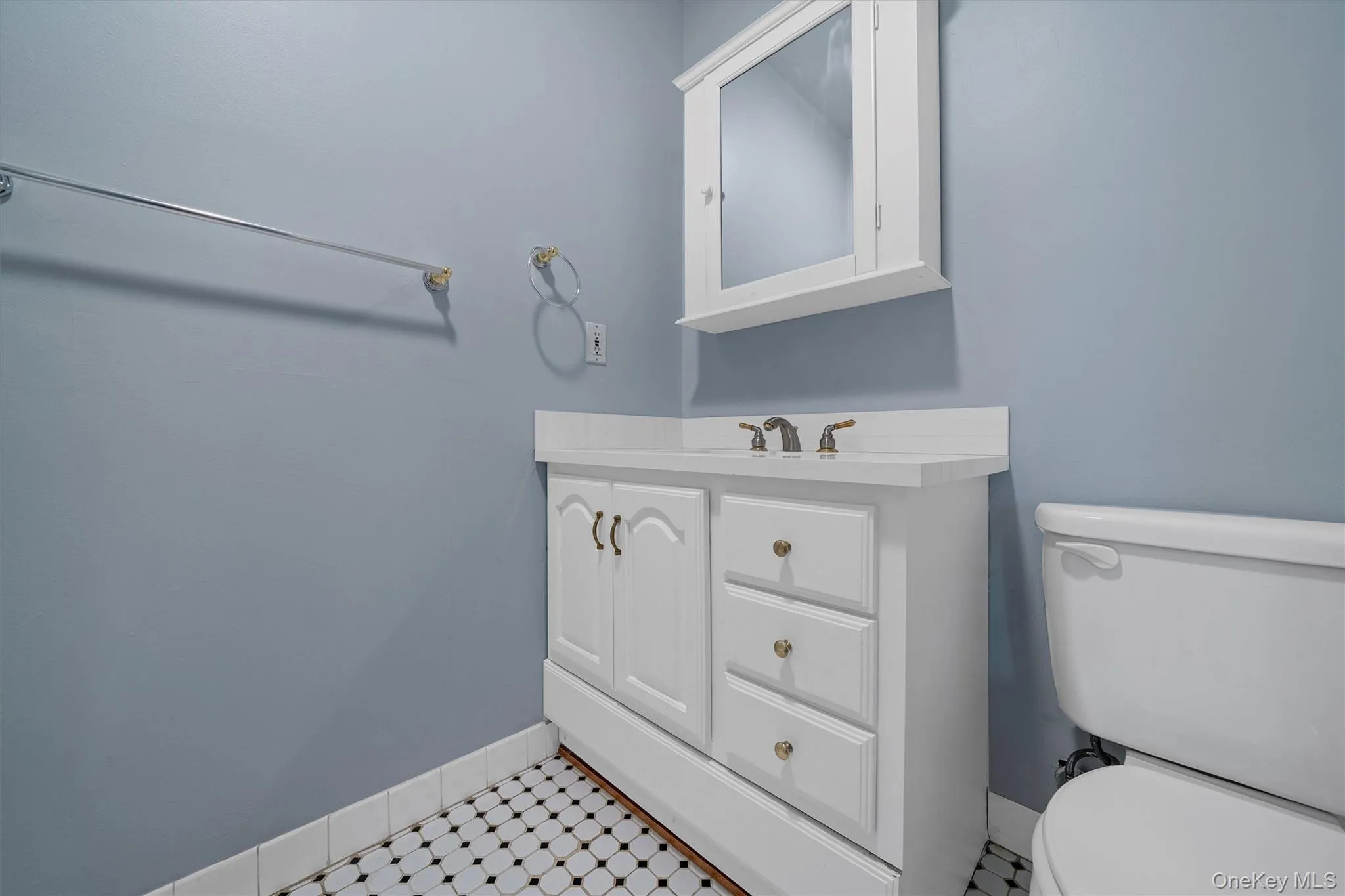 Full bathroom featuring toilet and vanity Full bathroom featuring toilet and vanity