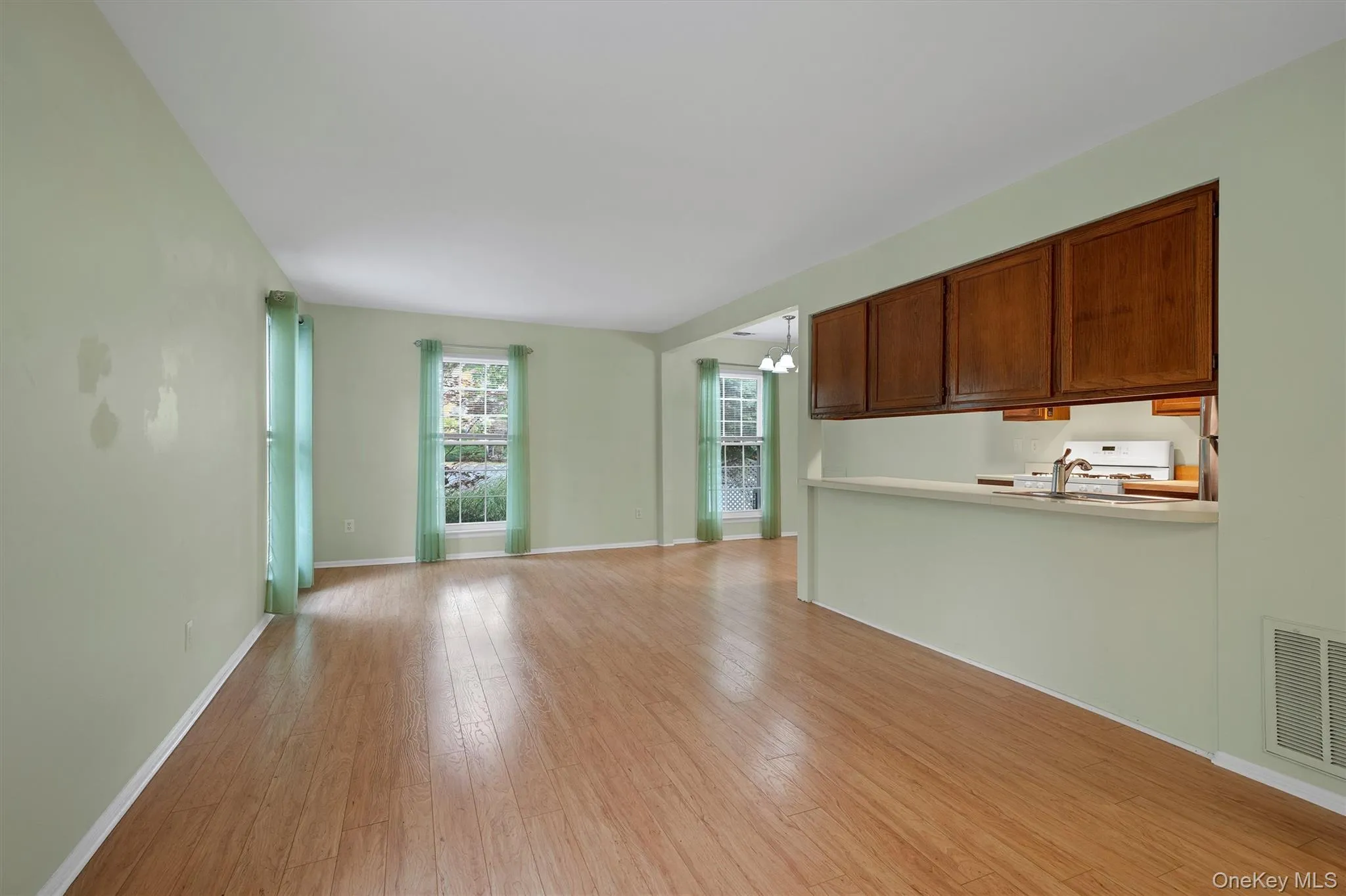 Unfurnished living room with light laminate floors Unfurnished living room with light laminate floors