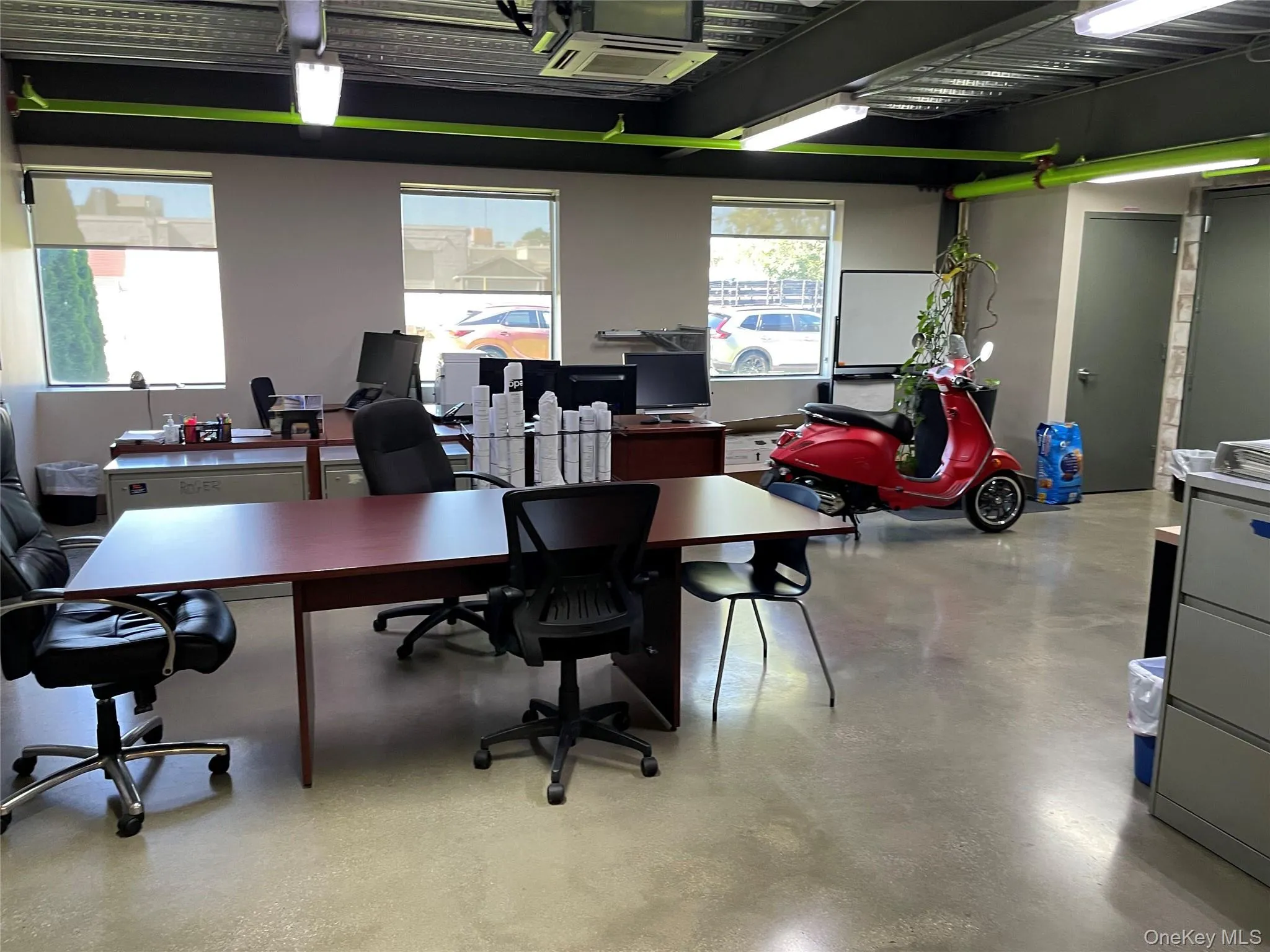 Office featuring concrete floors Office featuring concrete floors
