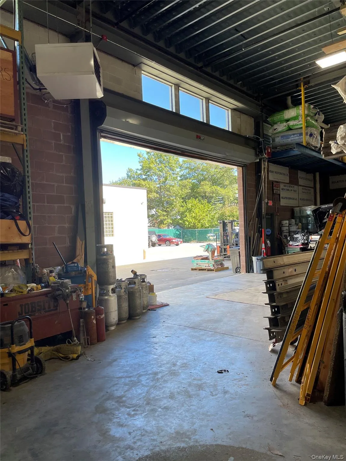 Garage featuring a workshop area Garage featuring a workshop area