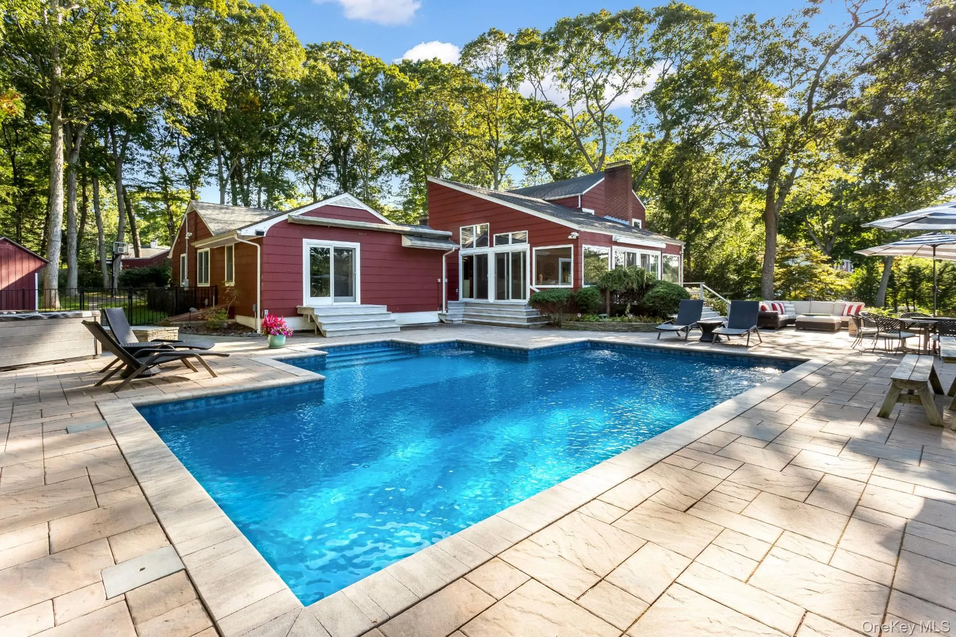 View of swimming pool featuring a patio area, entry steps, and outdoor lounge area View of swimming pool featuring a patio area, entry steps, and outdoor lounge area