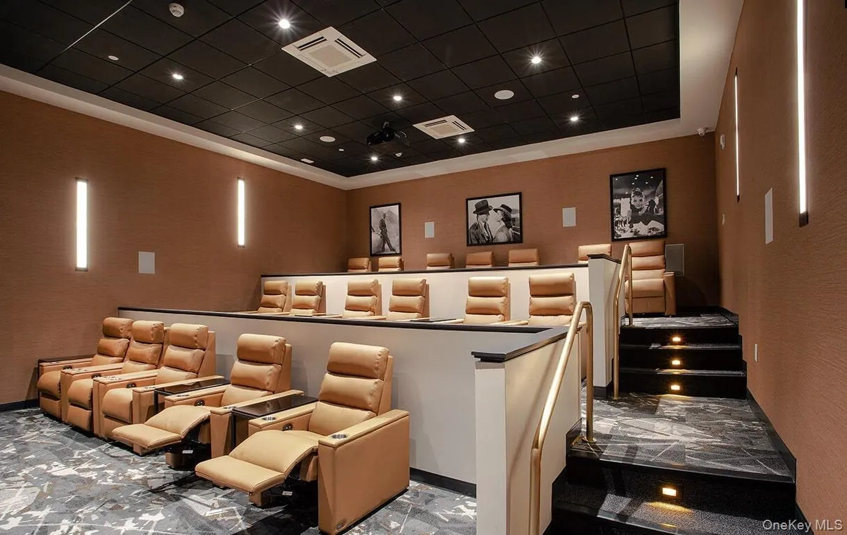 Cinema room featuring marble tiled flooring Cinema room featuring marble tiled flooring