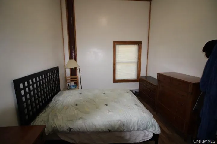 Bedroom with dark wood-type flooring Bedroom with dark wood-type flooring