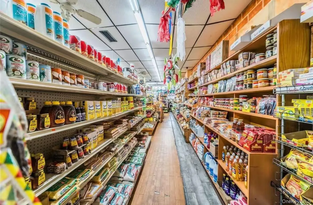 Misc room featuring a paneled ceiling and wood finished floors Misc room featuring a paneled ceiling and wood finished floors