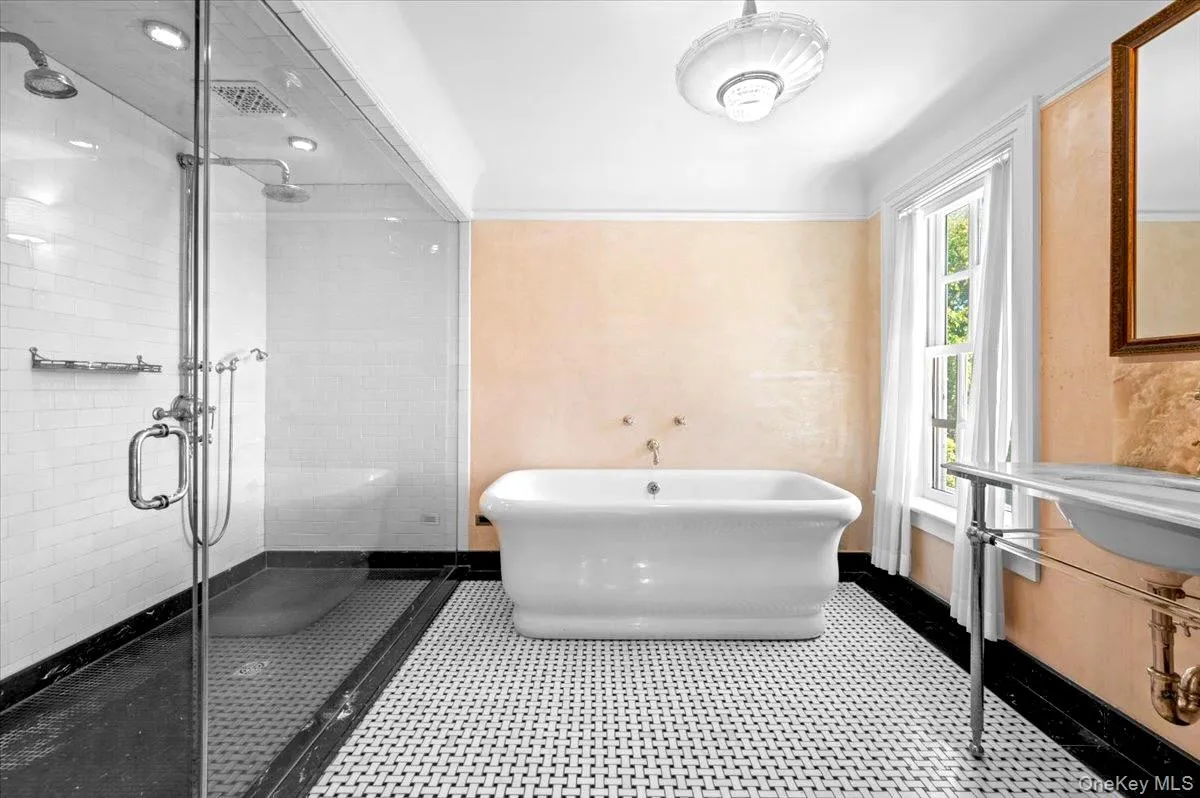 Full bathroom with a freestanding bath, a stall shower, and vanity Full bathroom with a freestanding bath, a stall shower, and vanity