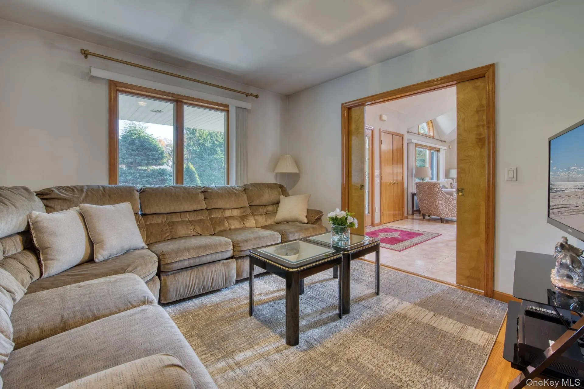 Living room with wood finished floors and baseboards Living room with wood finished floors and baseboards