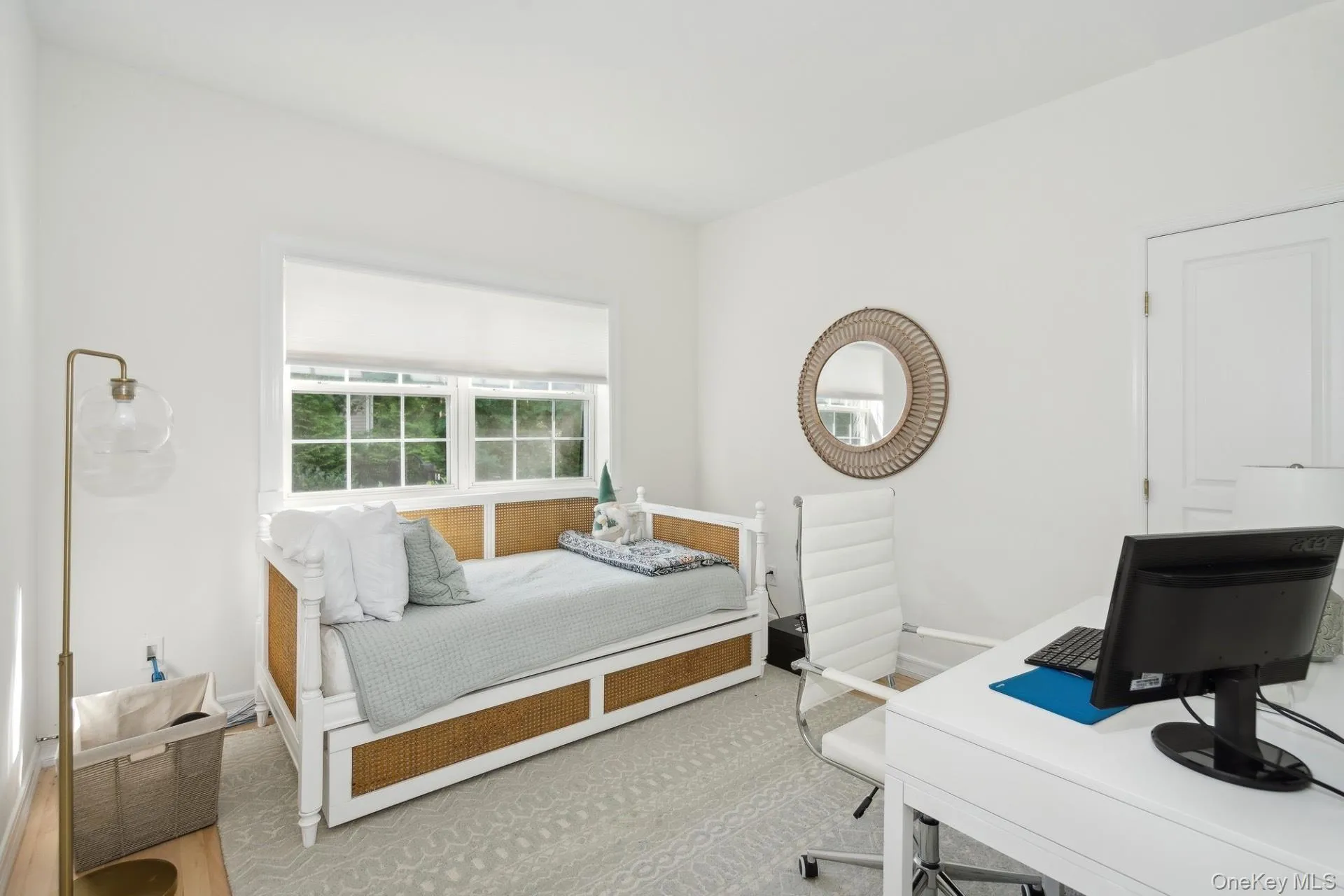 Bedroom featuring baseboards and a desk Bedroom featuring baseboards and a desk