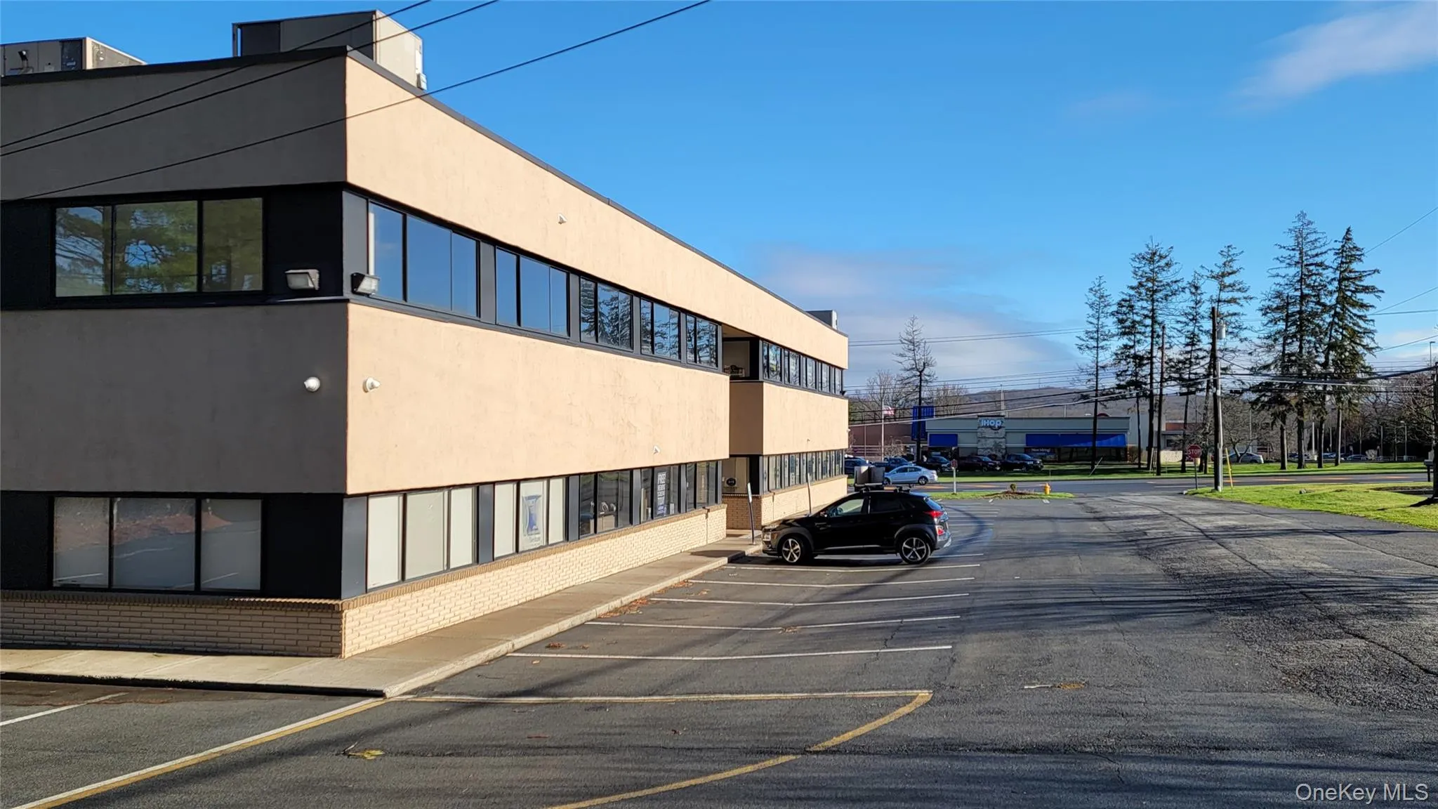 View of uncovered parking lot View of uncovered parking lot