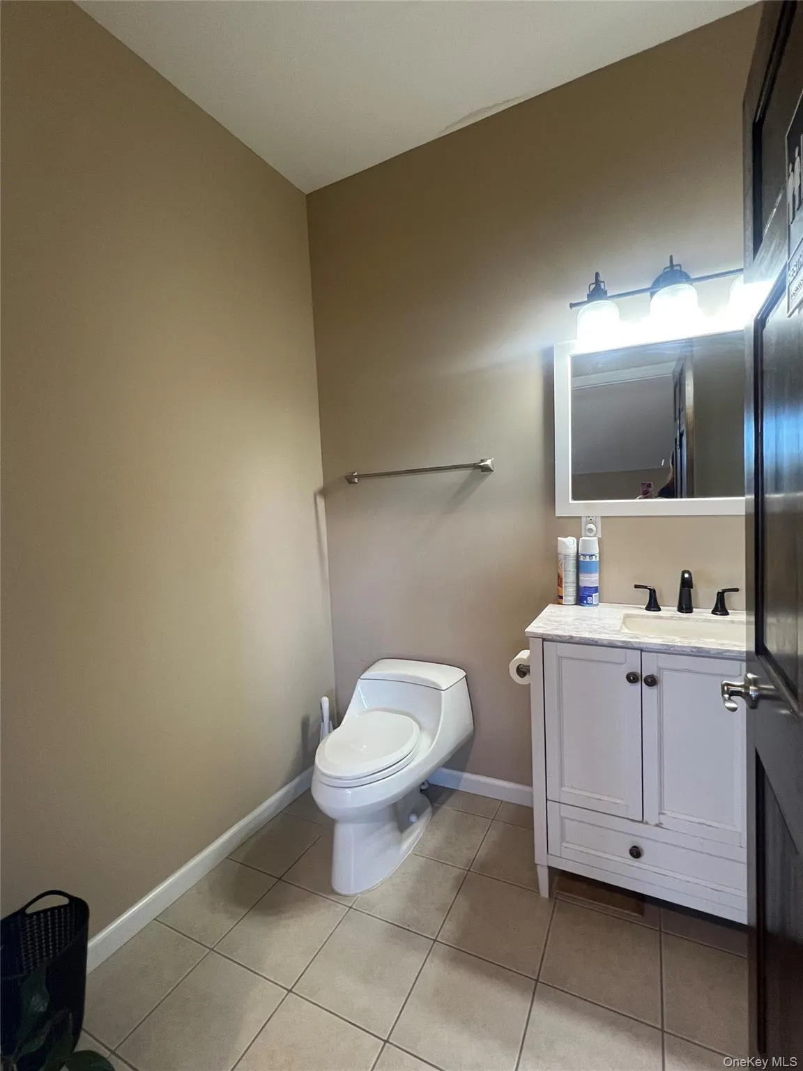 Bathroom with vanity and light tile patterned flooring Bathroom with vanity and light tile patterned flooring