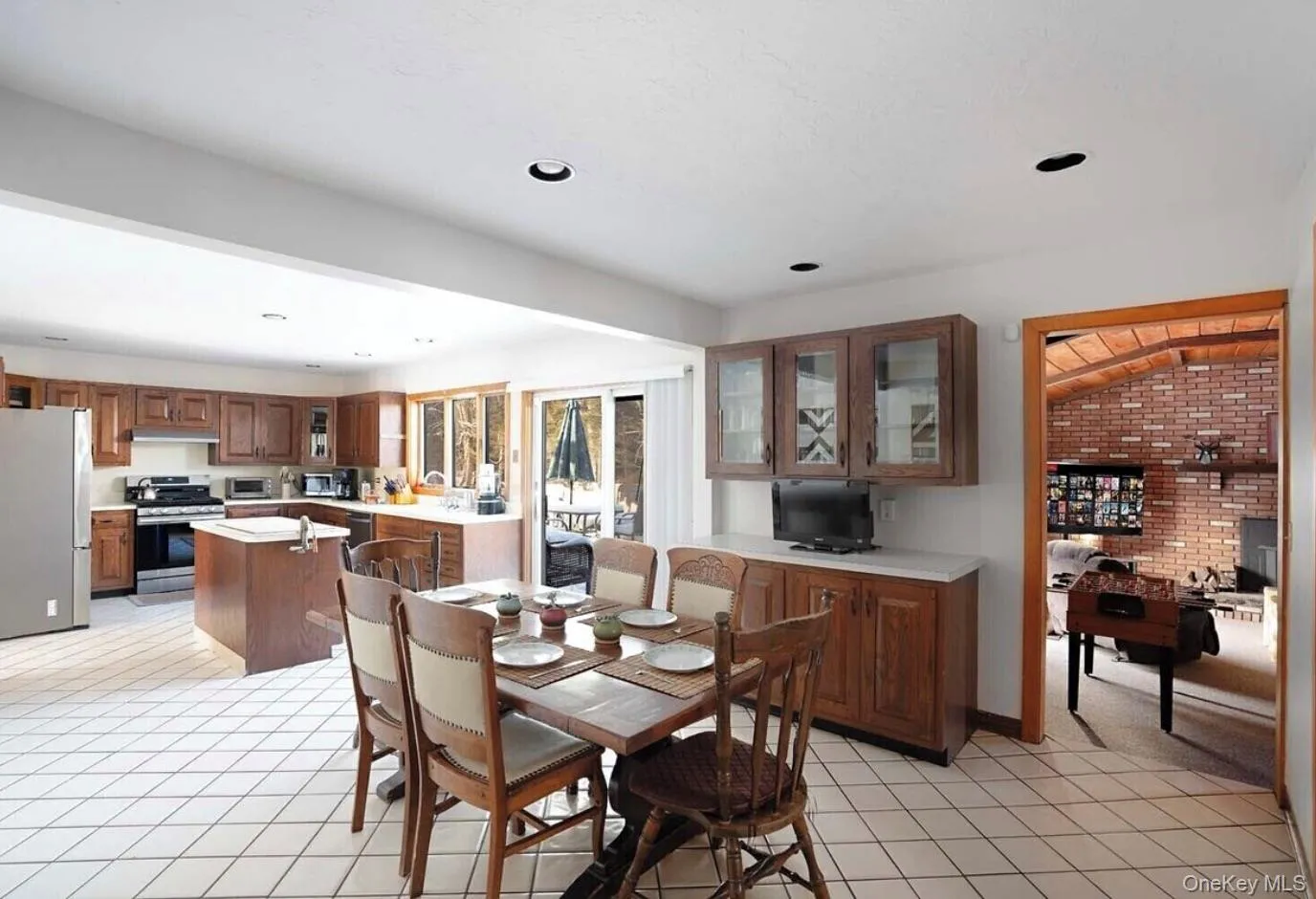Dining area with light tile patterned floors and recessed lighting Dining area with light tile patterned floors and recessed lighting