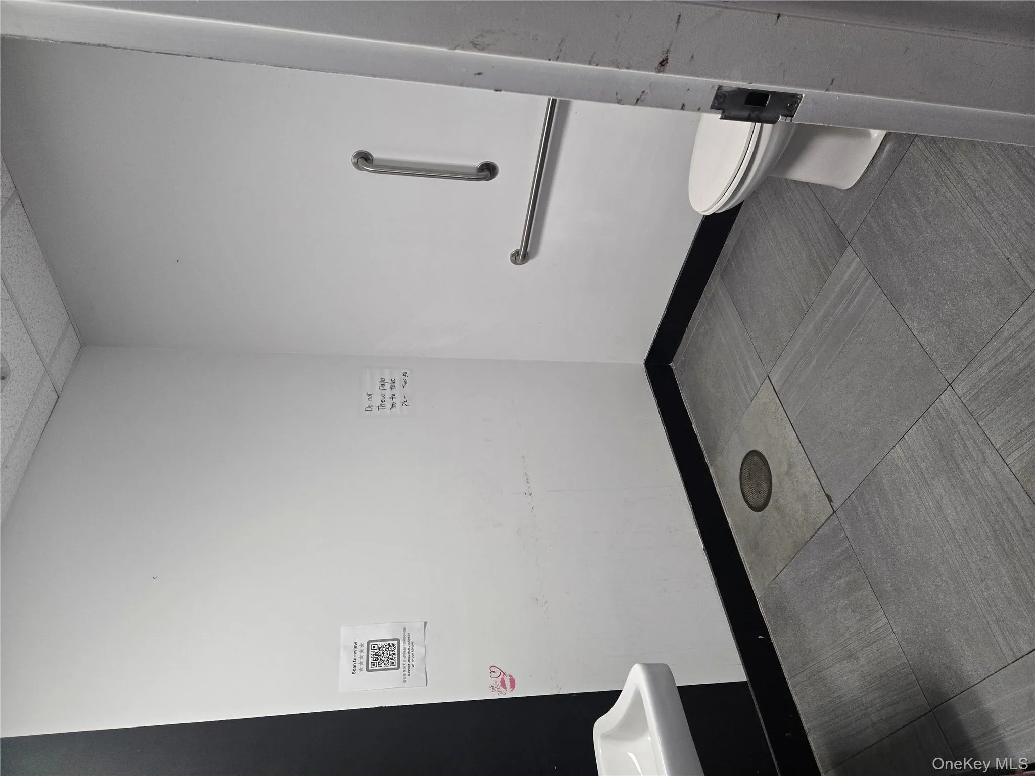 Half bathroom featuring a drop ceiling and vanity Half bathroom featuring a drop ceiling and vanity