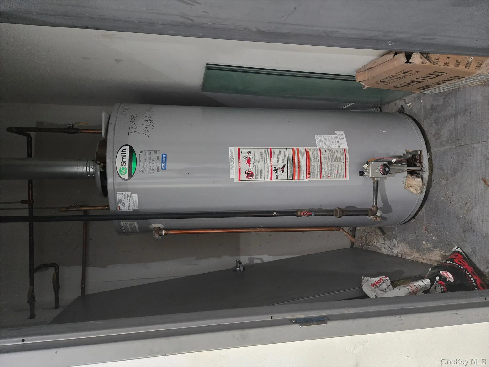 Utility room with water heater Utility room with water heater