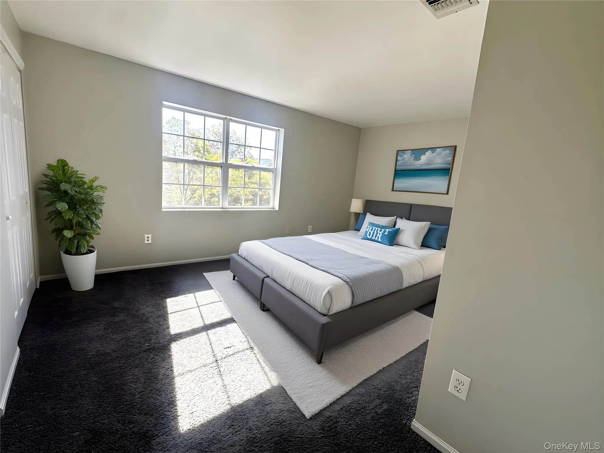 Carpeted bedroom with baseboards Carpeted bedroom with baseboards