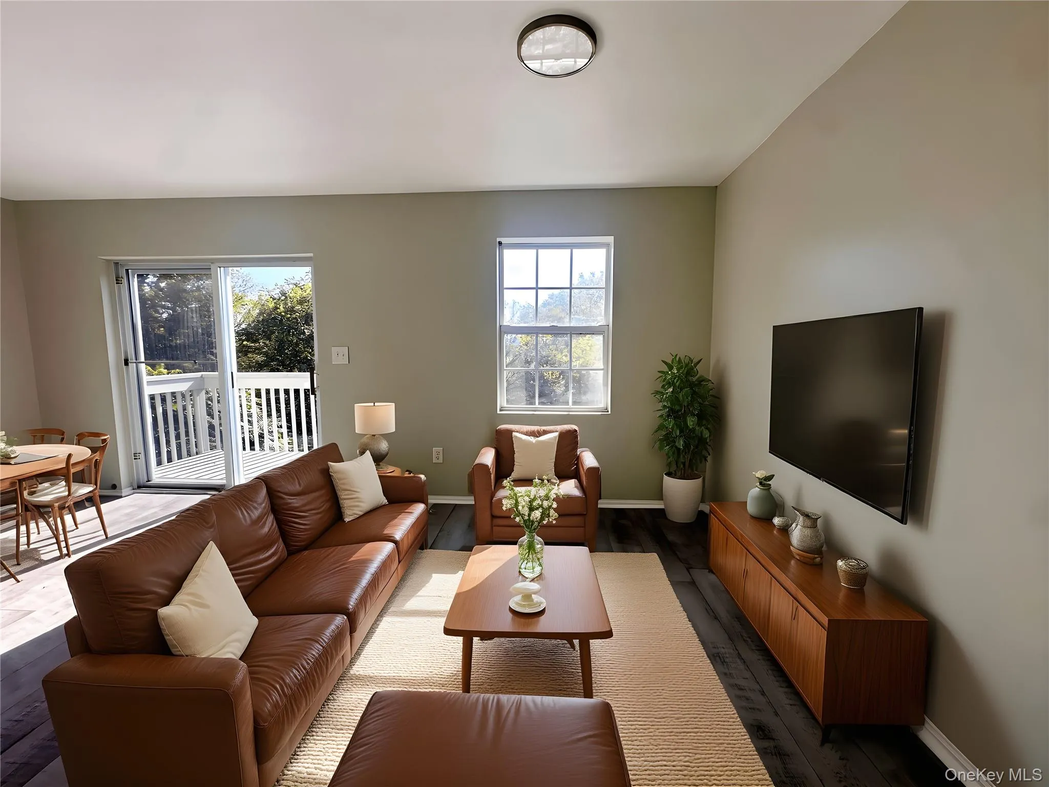 Living area with wood finished floors and baseboards Living area with wood finished floors and baseboards