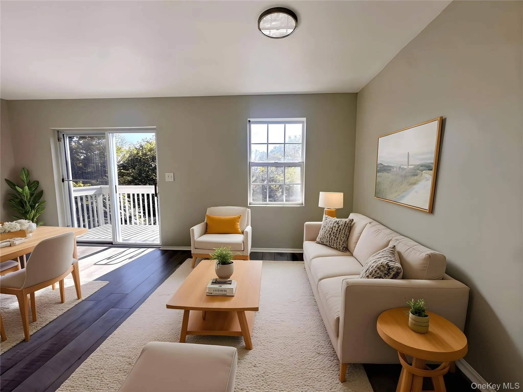 Living area featuring wood finished floors and baseboards Living area featuring wood finished floors and baseboards