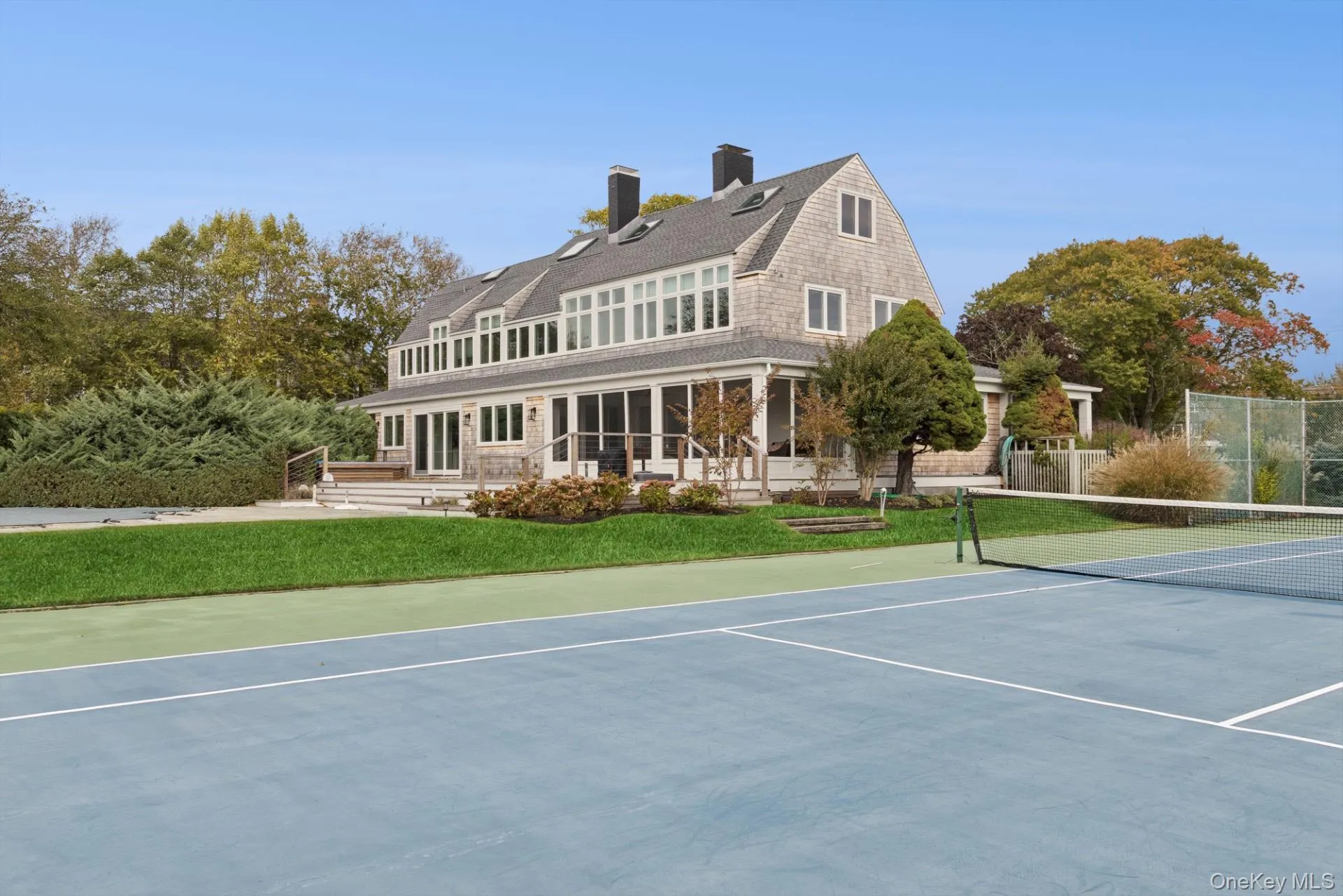 View of tennis court with community basketball court View of tennis court with community basketball court