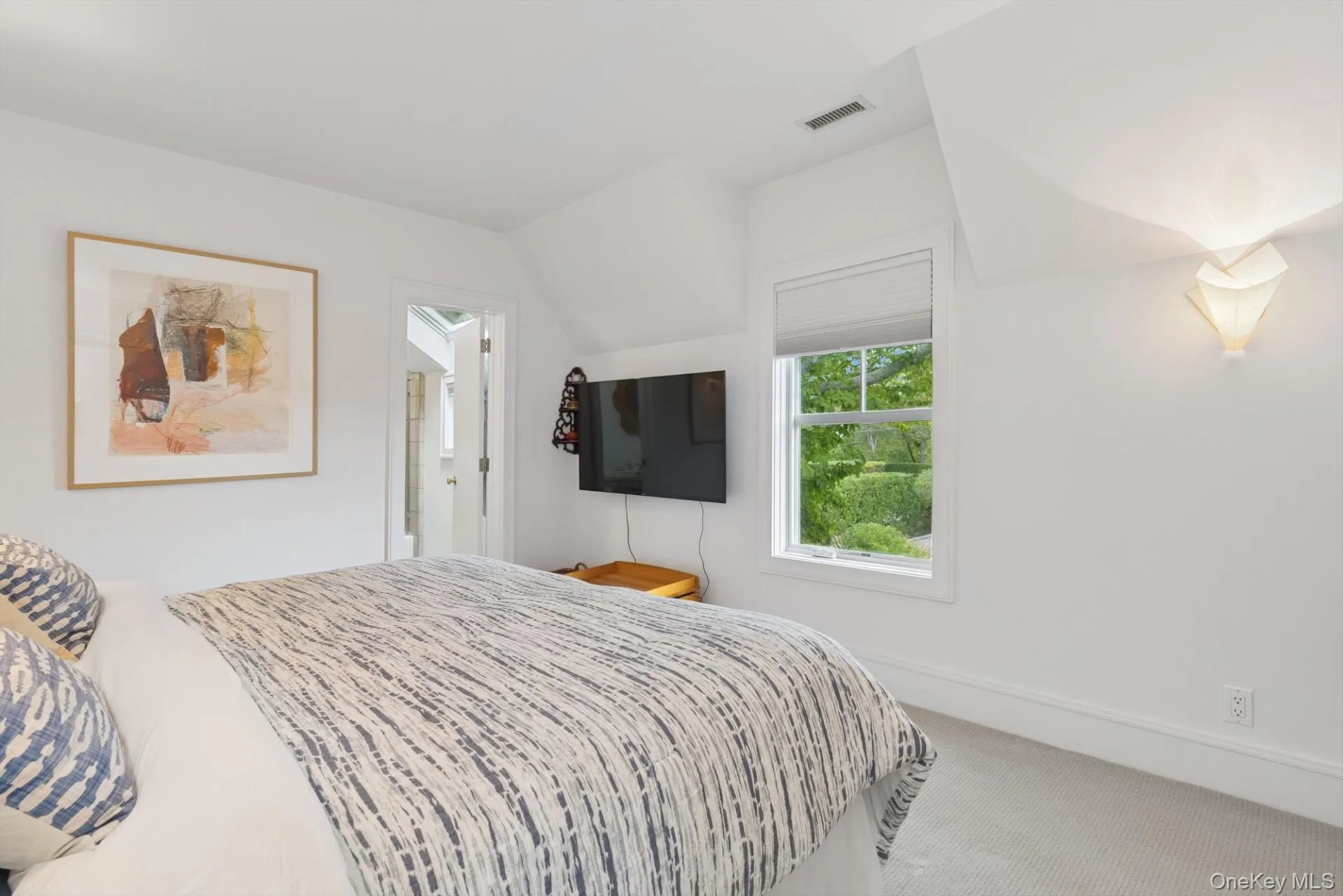 Carpeted bedroom featuring baseboards Carpeted bedroom featuring baseboards