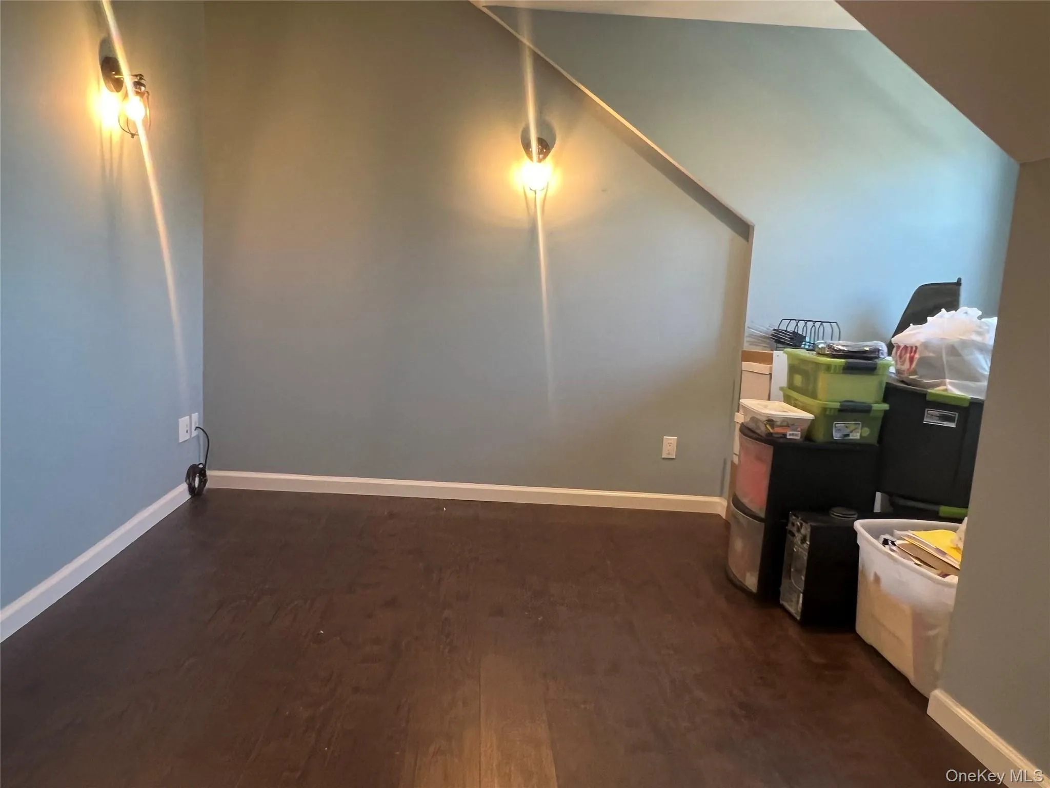 Conference Room featuring baseboards and dark wood-type flooring Conference Room featuring baseboards and dark wood-type flooring